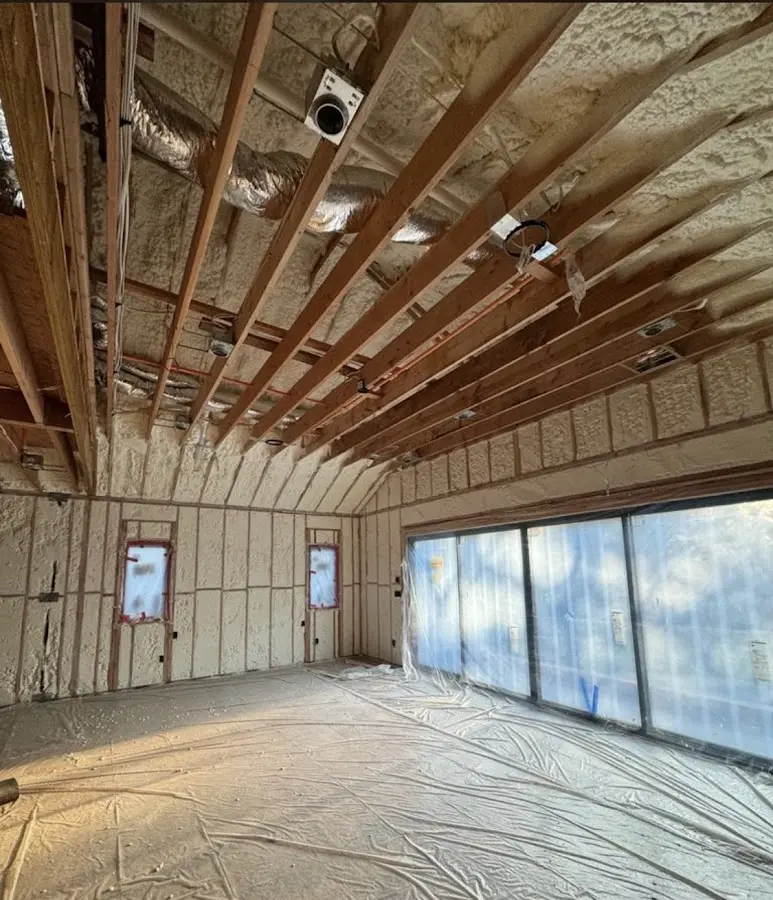 Interior walls and ceiling insulated with spray foam during new construction in Glenwood